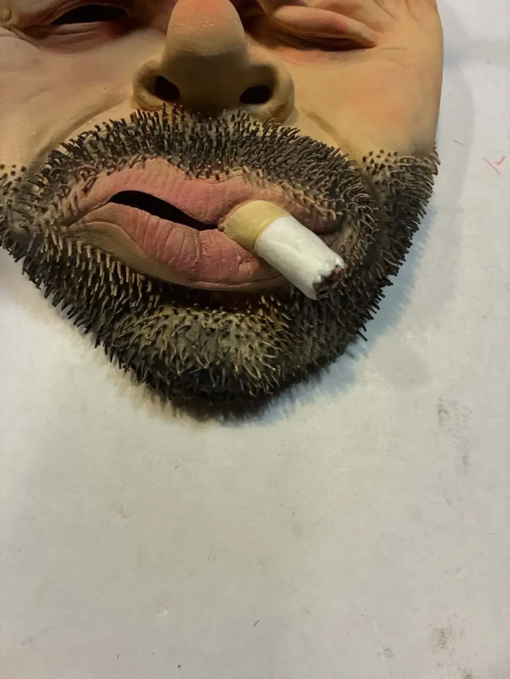 Realistic Man with Beard and Cigarette Latex Novelty Mask with Red Cap